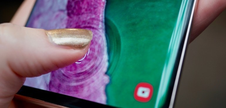 Samsung Galaxy S10 Plus fingerprint scanner in use hero size