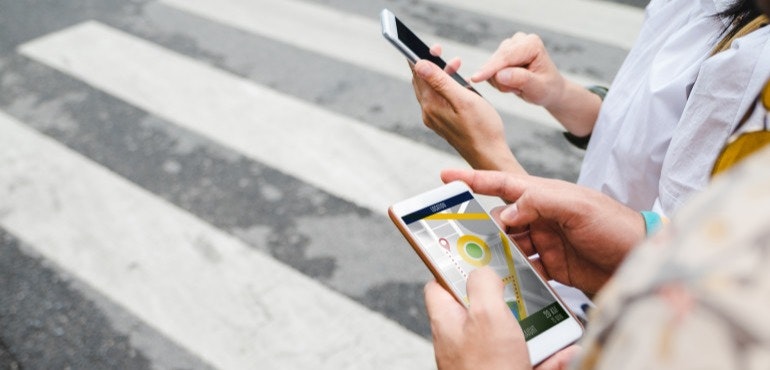 Woman sharing location GPS maps on smartphone